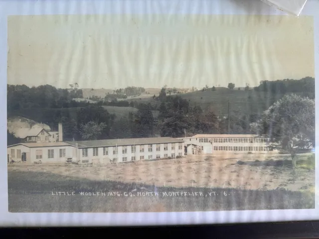 Hand-tinted color postcard of the Little Woolen Mfg. Co. mill complex.